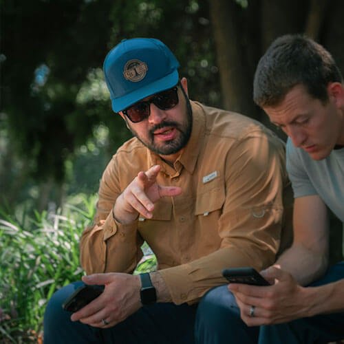 BTI Director, Micah McCurry, speaking with a missionary partner & film producer