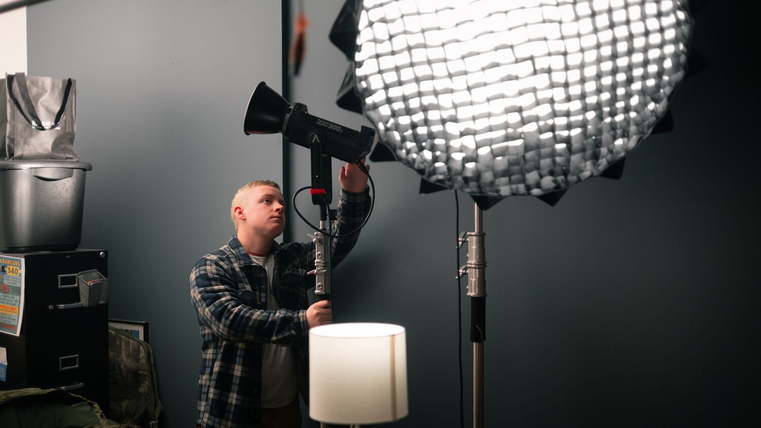 Gilbert Consford setting lighting for a video